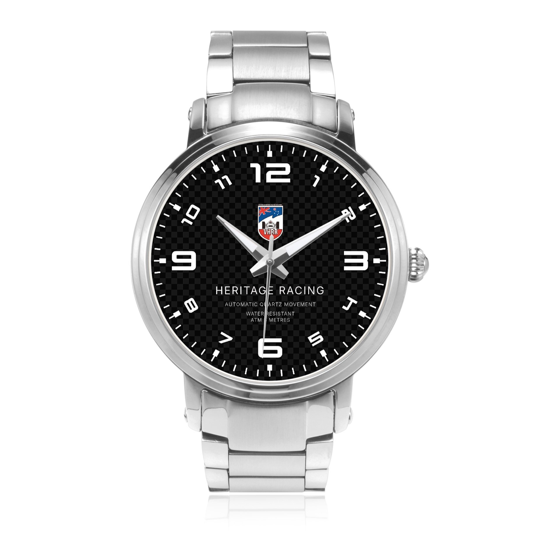 A silver wristwatch with a black carbon fiber patterned dial, displaying the time as 10:12:29, with white numerals and markers, and a metal link band.