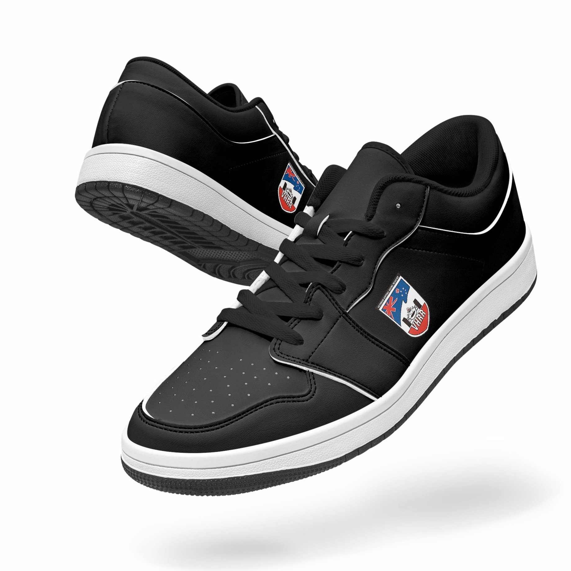 Black and white sneakers with a logo on the side featuring a star and a kangaroo, floating against a white background.