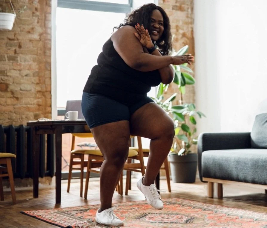 woman dancing to regulate her nervous system to ease anxiety, stress, fear, and pain