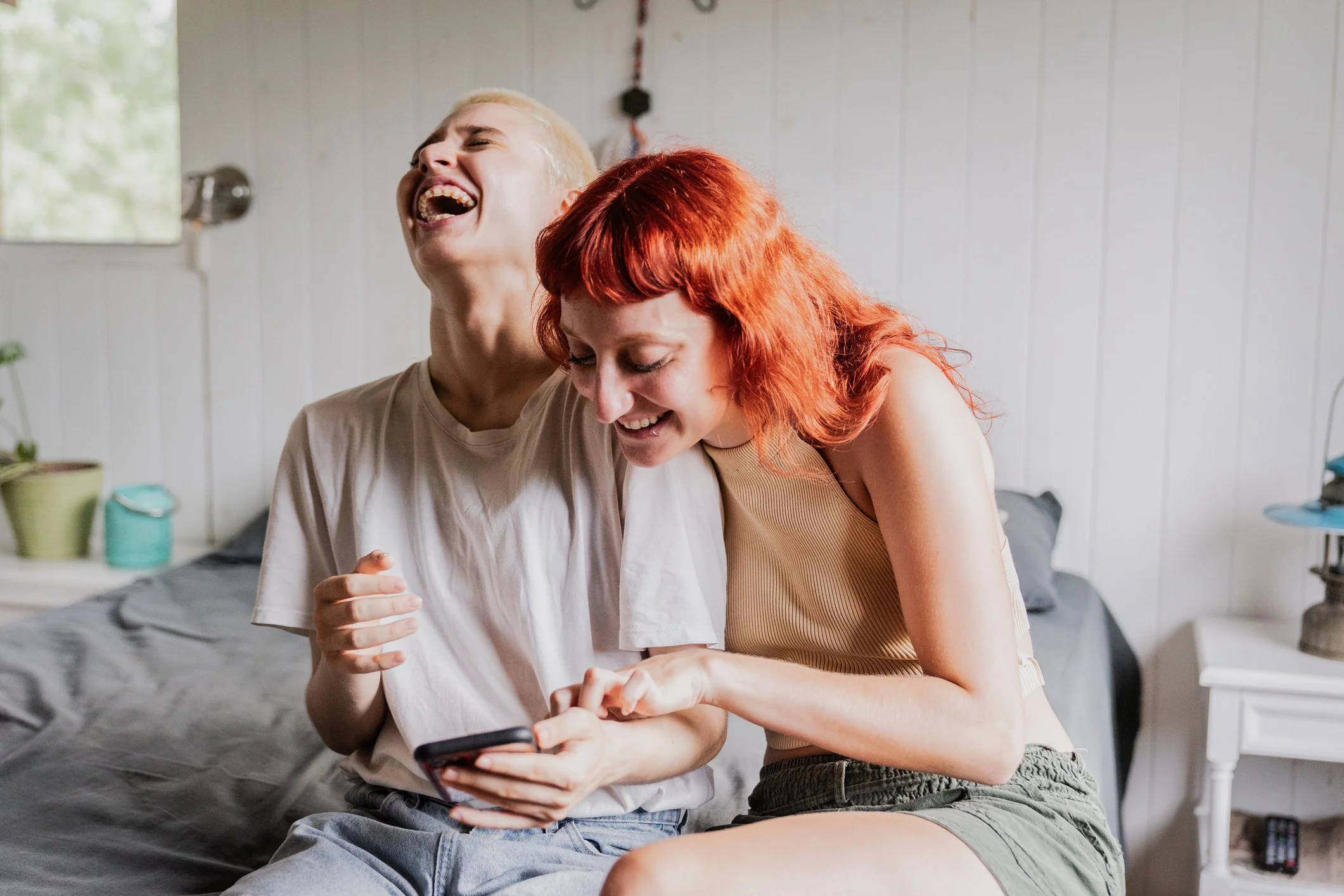 couple laughing together as they build their relationship communication skills