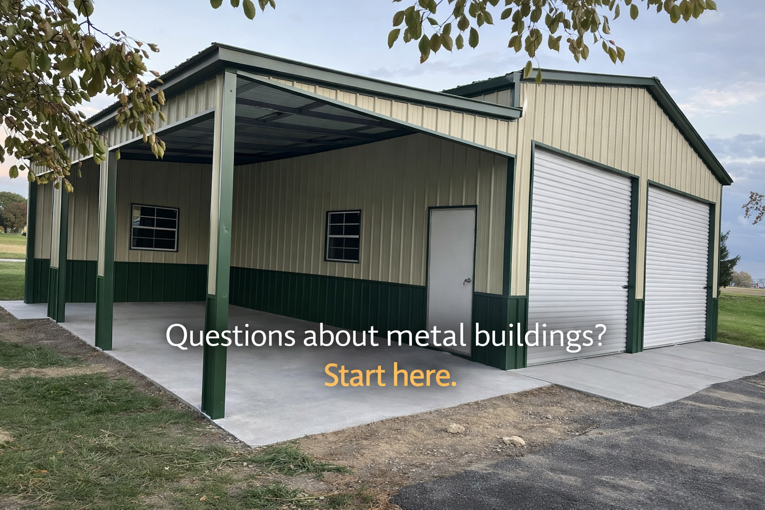 Green and beige metal building with roller doors and windows, set on concrete with grass and dirt around, under a cloudy sky. Text overlay says, 'Questions about metal buildings? Start here.'