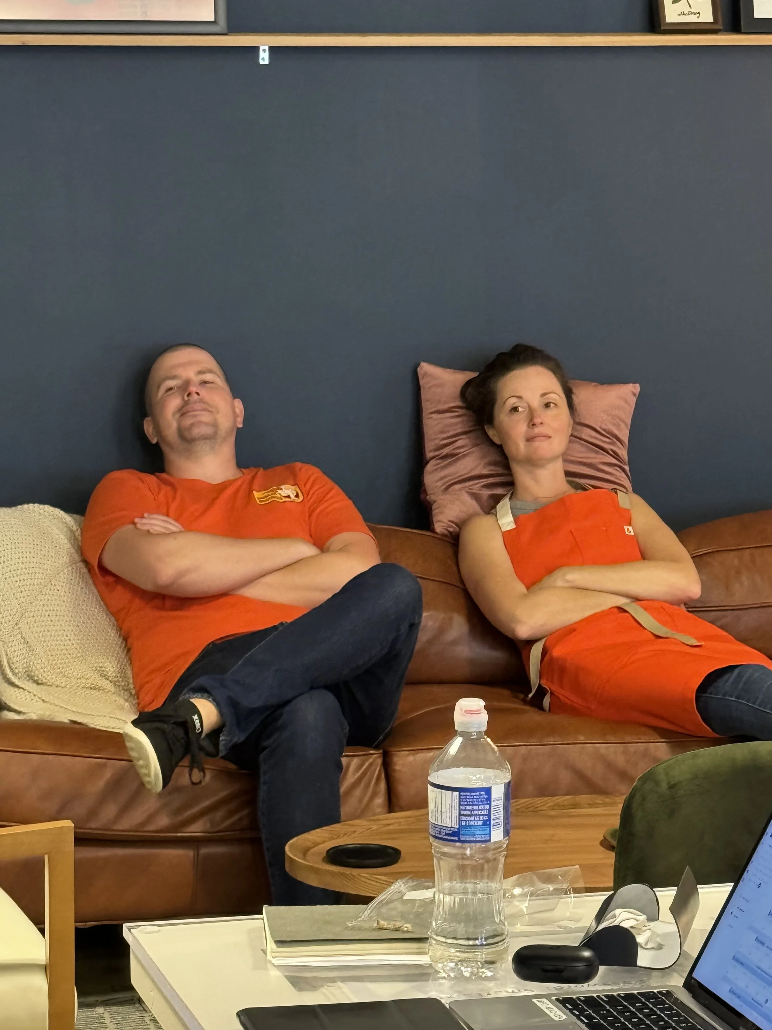 Behind the scenes of Aaron and Meagan taking a break on set, somehow looking exactly the same.