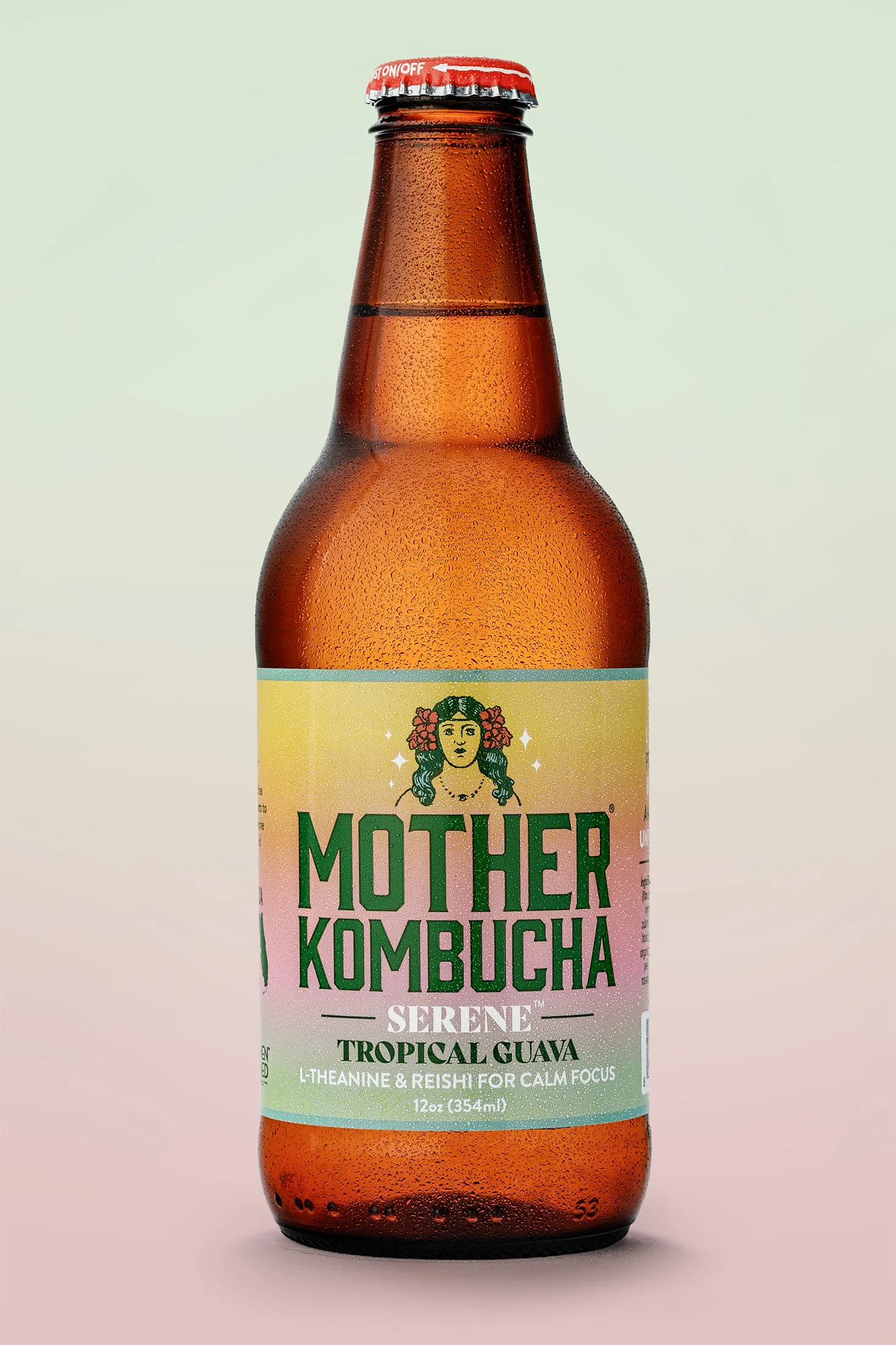 A bottle of Mother Kombucha with a pink gradient label featuring an illustration of a woman with flowers in her hair, and text indicating flavor as Tropical Guava and ingredients like L-theanine and reishi for calm focus.
