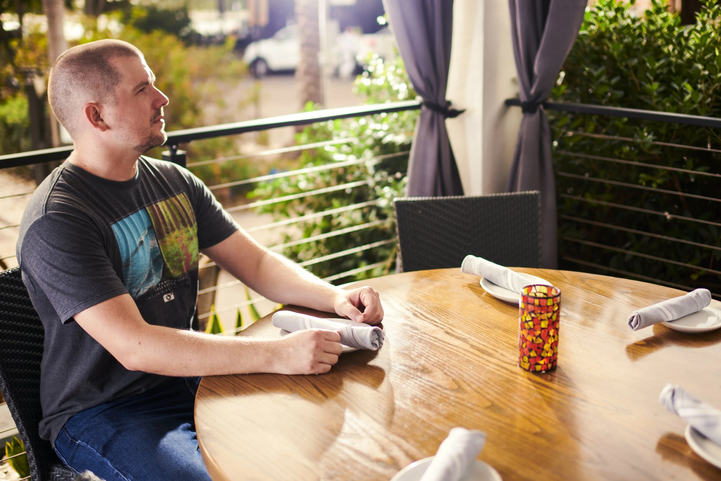 Aaron sitting in for a light test at an outdoor shoot location.
