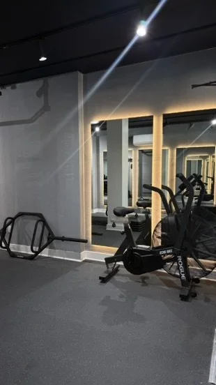 A clean gym. A trap deadlift bar, assault bike for cardio, pull up bar, and plenty of space to workout with no lines to wait for machines