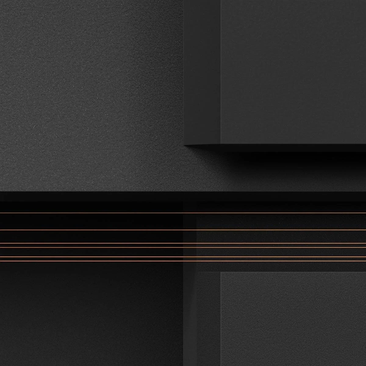 Close-up of a black electronic device with a matte finish and rose gold lines.