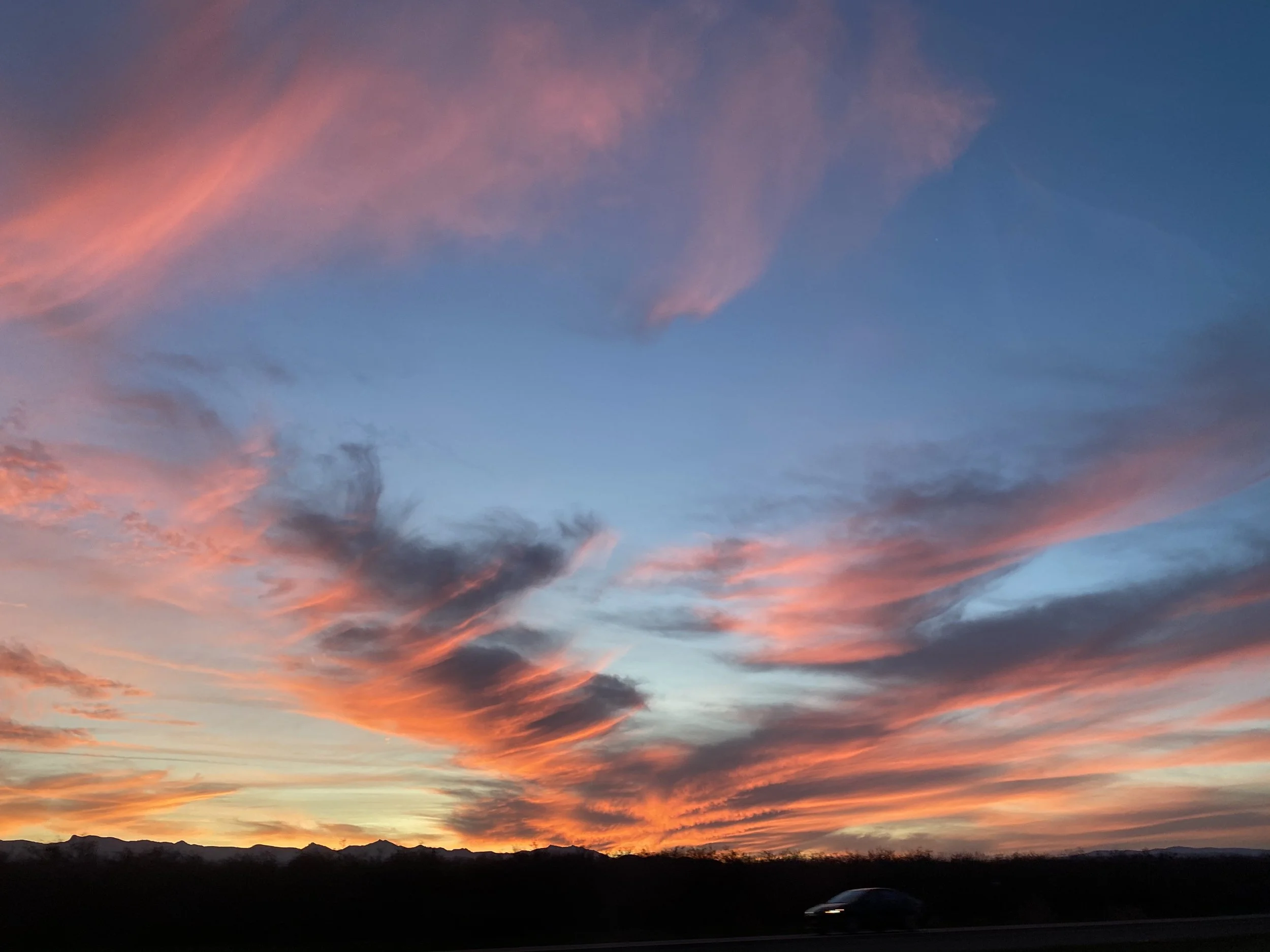 beautiful sunset, southwest sunset, new mexico, sunset with blue, orange, and yellow streaks, wispy clouds