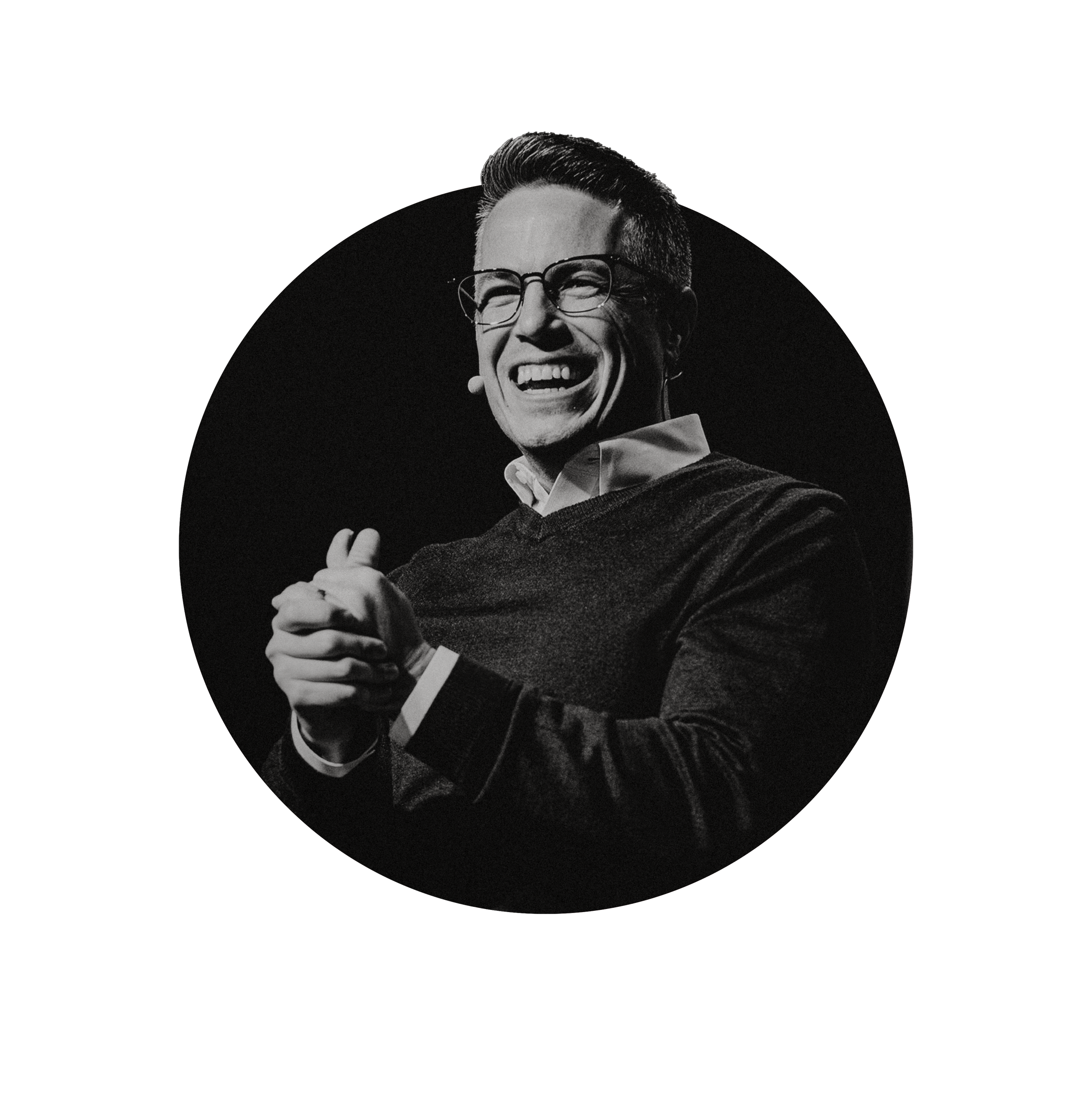 Black and white photo of Josh Teis, Pastor of Southern Hills Church in Las Vegas, Nevada, wearing a collared shirt and sweater, giving a thumbs-up.