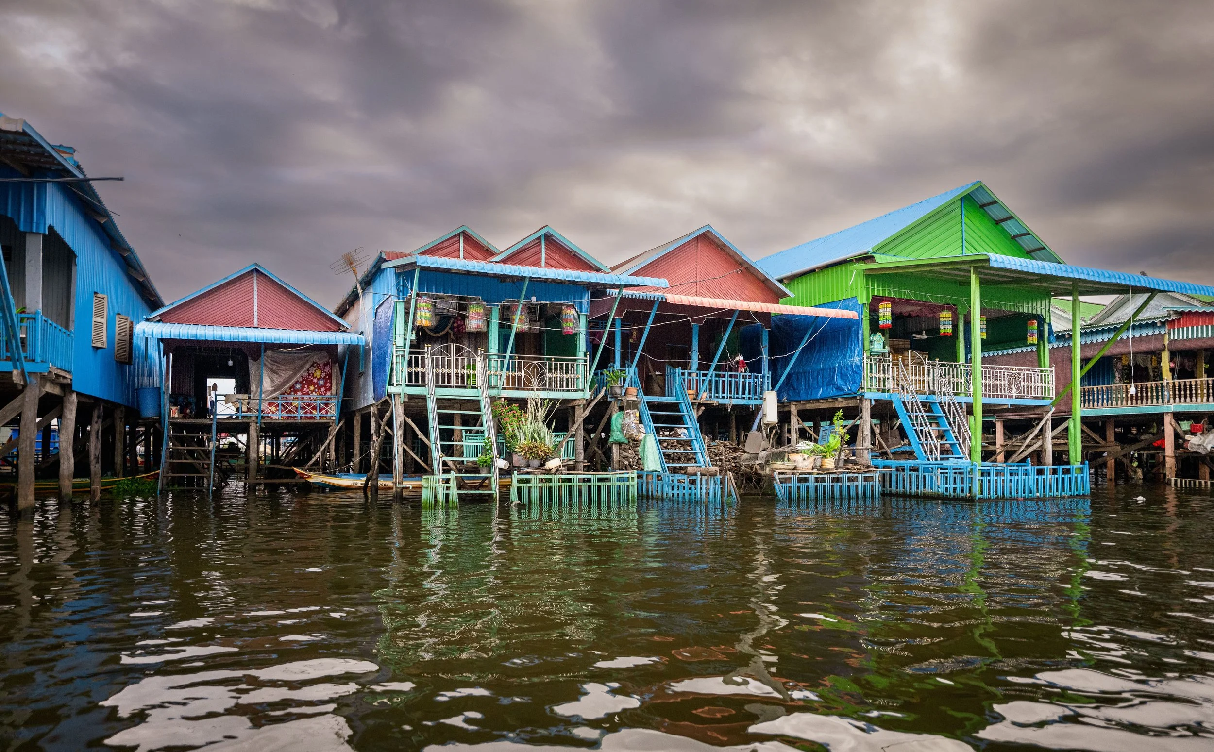 The floating village of Tonle Sap Lake is a profound example of human adaptation.  Tonle Lake is Southeast Asia's larges freshwater lake. The water levels fluctuate dramatically depending on the season. During the rainy season, shown here, the lake i