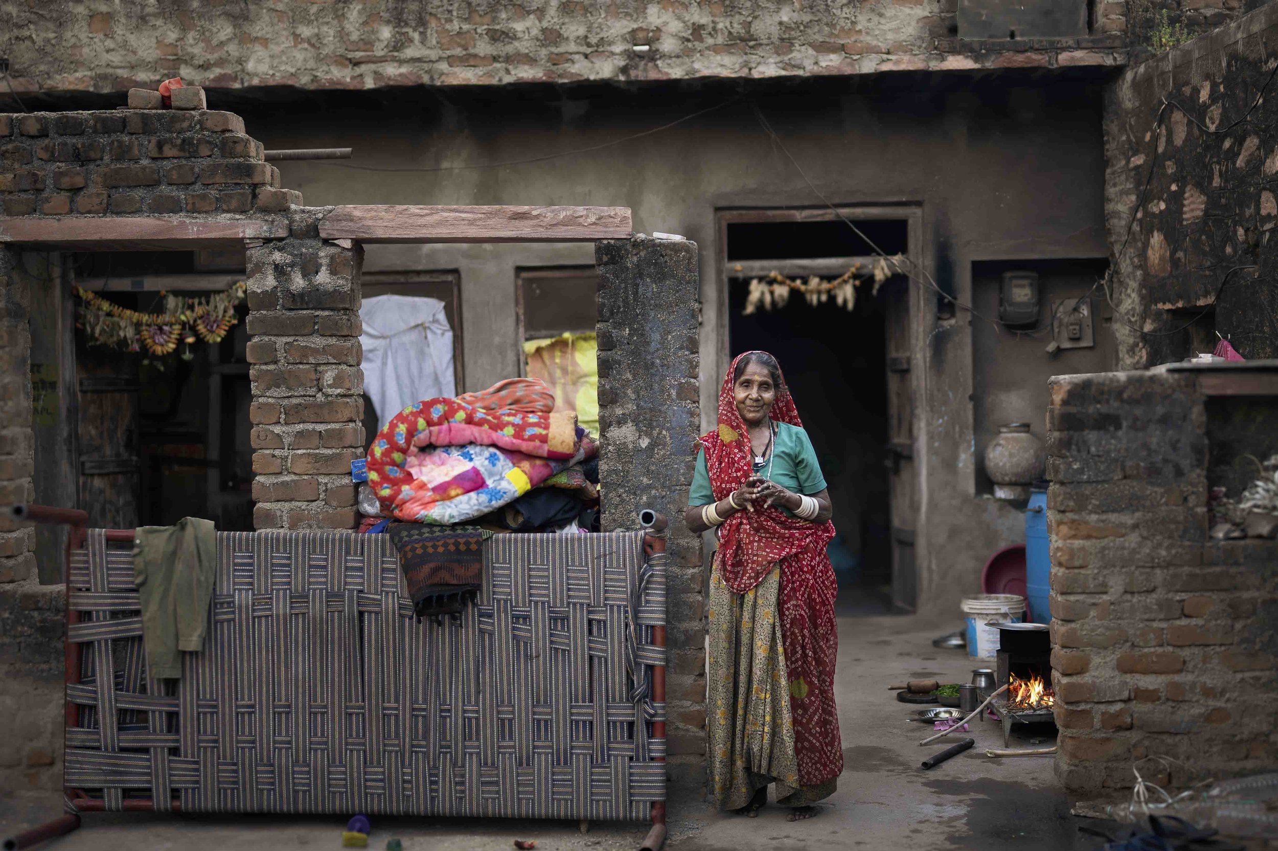 This lovely Rabari woman paused making breakfast on her wood-fired stove to greet me.
