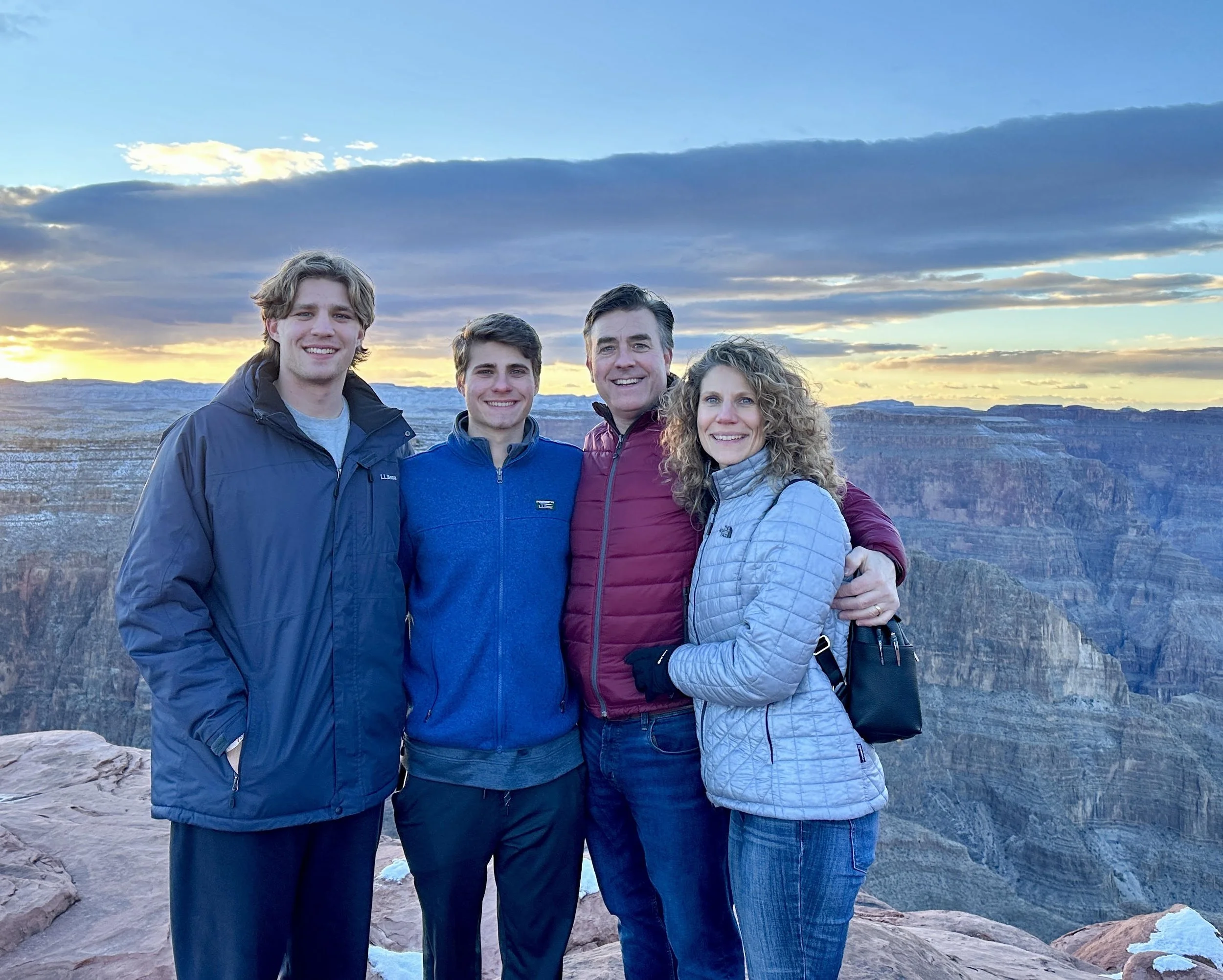 travel agent and her family with mountain sunset