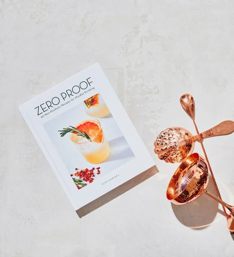 Zero Proof: 90 Non-Alcoholic Recipes for Mindful Drinking” by Elva Ramirez, a globally recognized book exploring the non-alcoholic cocktail movement. Mixologist David Paz is mentioned, highlighting his presence within contemporary mixology.