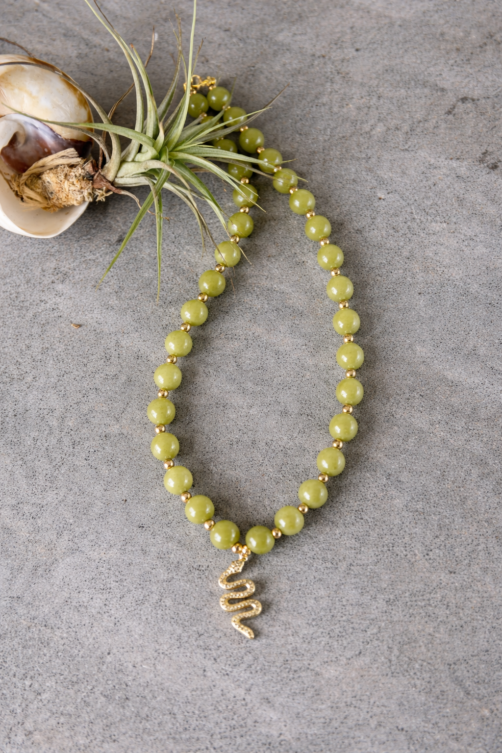 Elegant green jade necklace and accessories.png