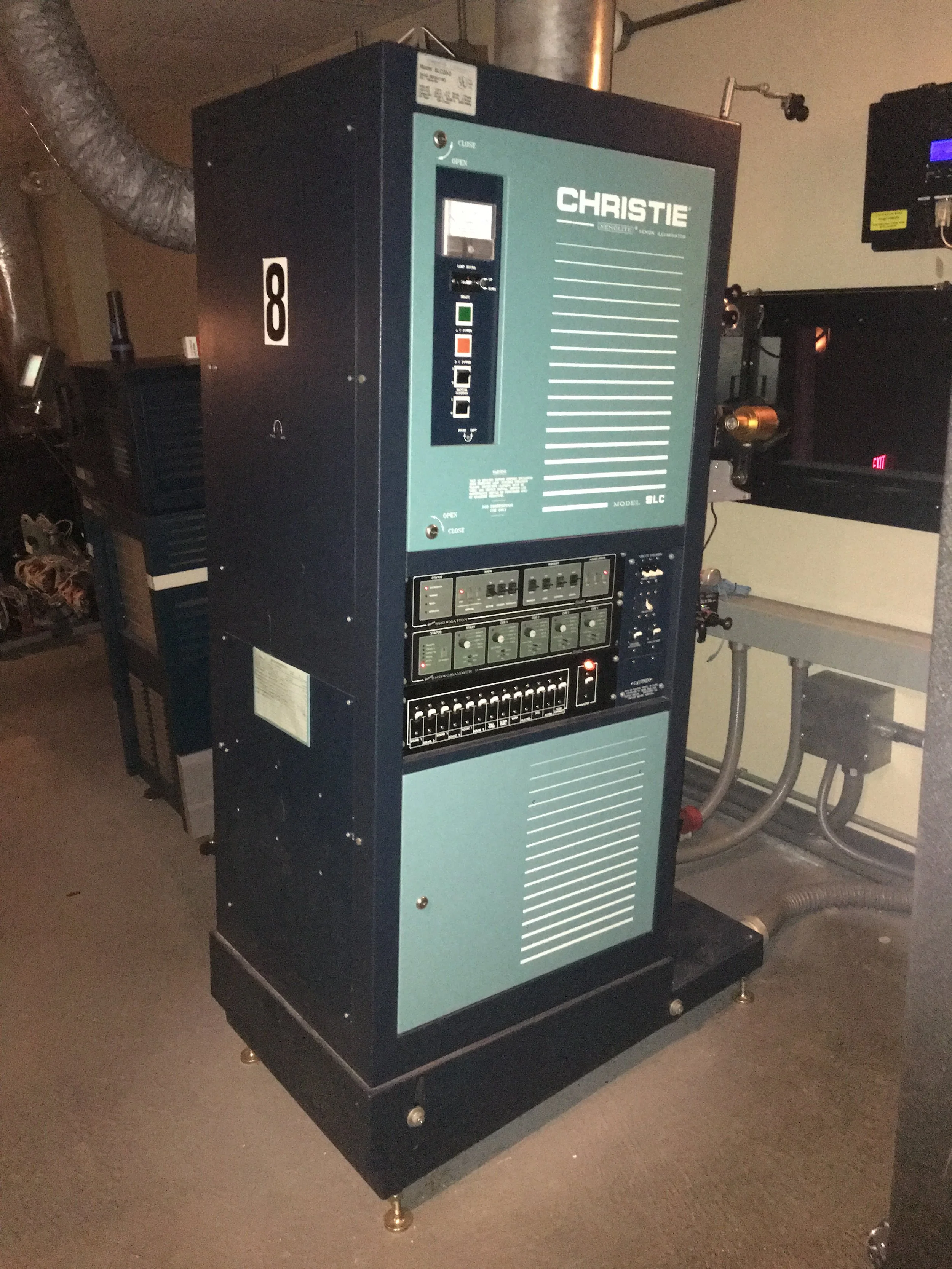 A large commercial air conditioning or refrigeration unit labeled 'Christie' with control panels and vents, located in an industrial setting.