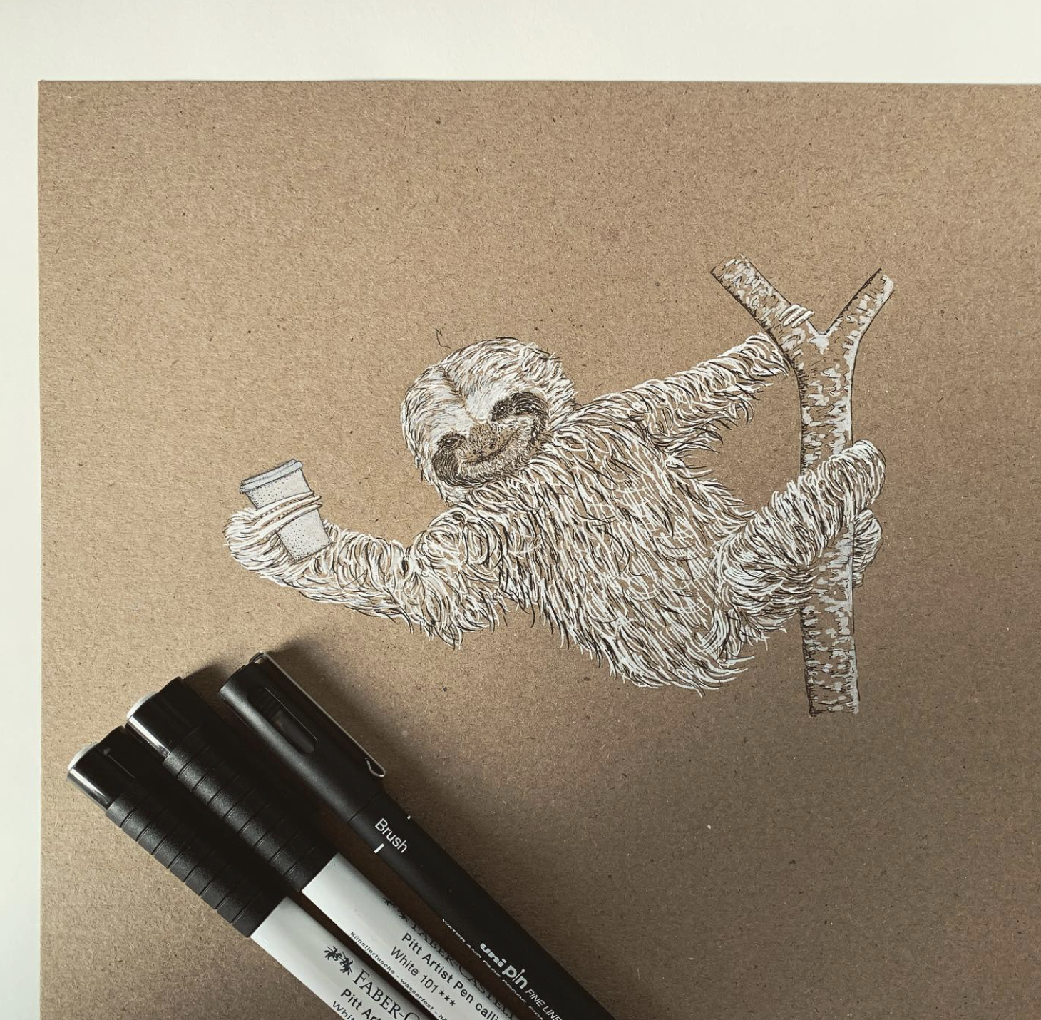Artwork of a smiling sloth hanging from a branch, holding a coffee cup.