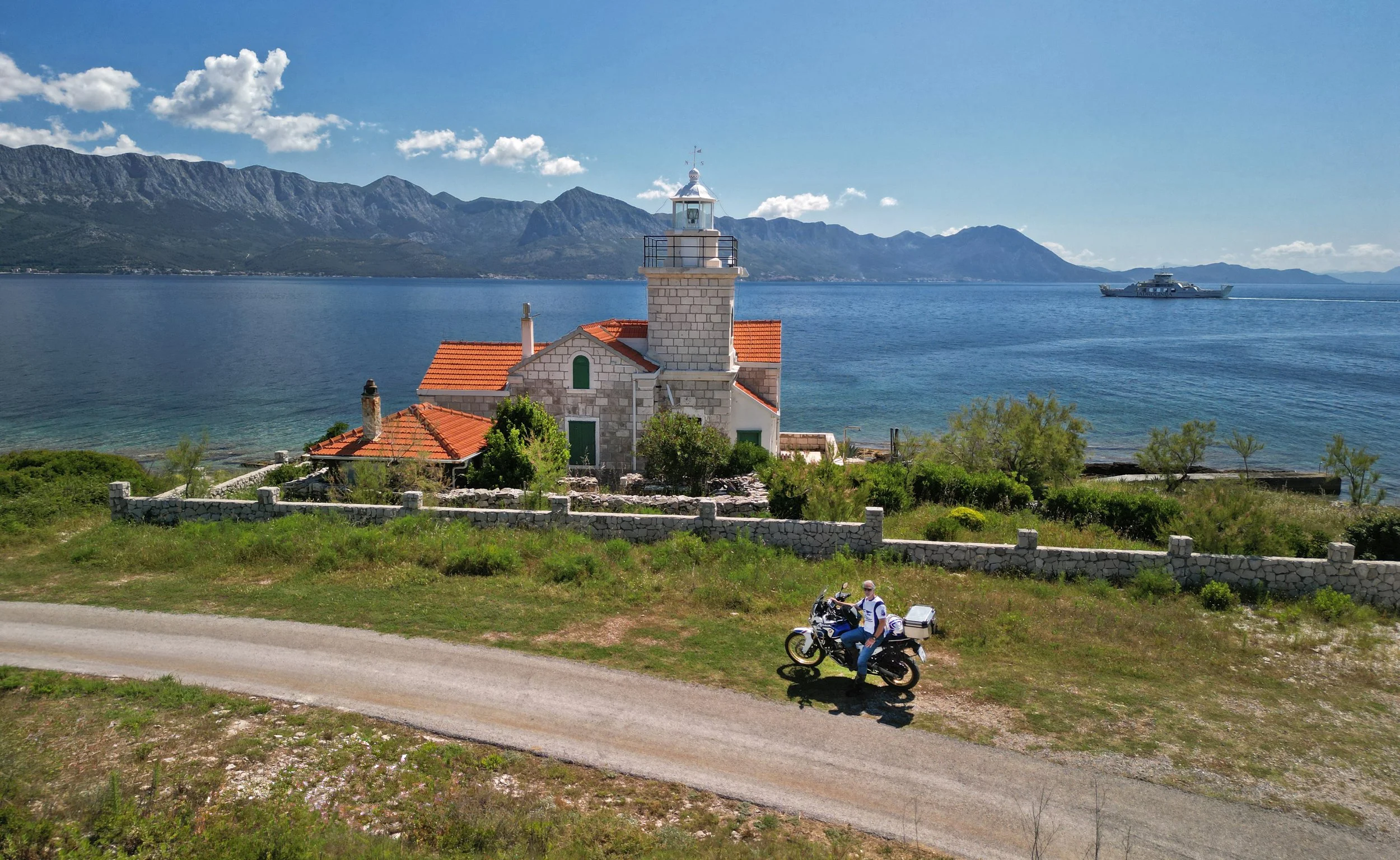 Lighthouse on the Island of Hvar. Motorcycle route by the sea.