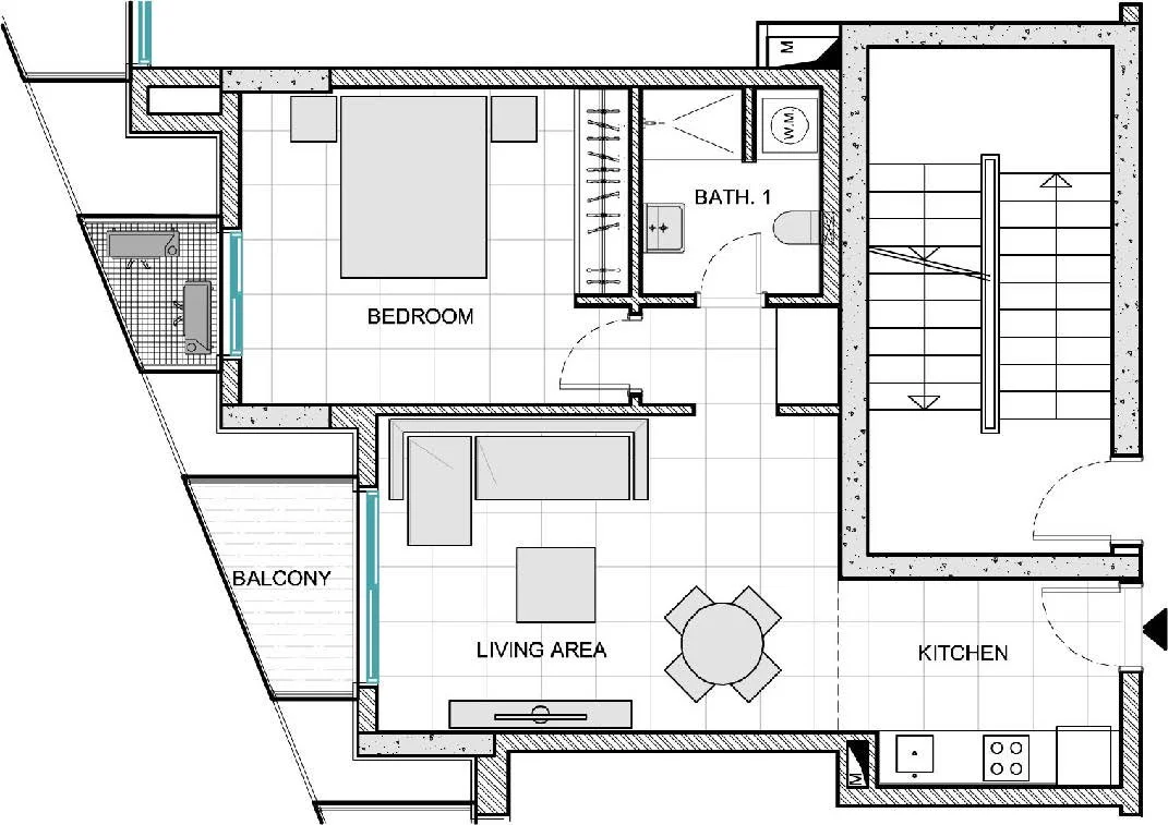 Floor plan of an apartment showing a bedroom, living area, kitchen, bathroom, balcony, and staircase.