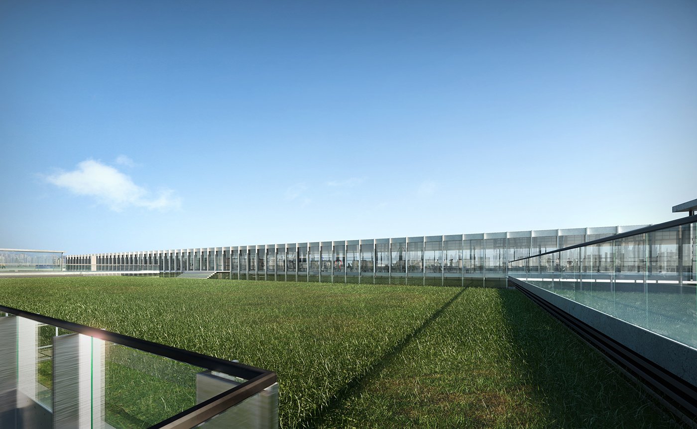 Modern glass building with a rooftop green lawn under a clear blue sky.