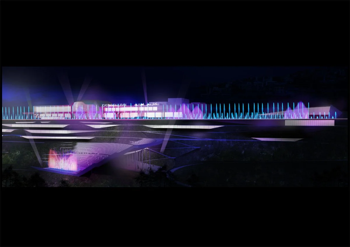 Night view of a modern building with colorful illuminated fountains in front. The building has bright signage, possibly a casino or public venue, with a futuristic architectural style.