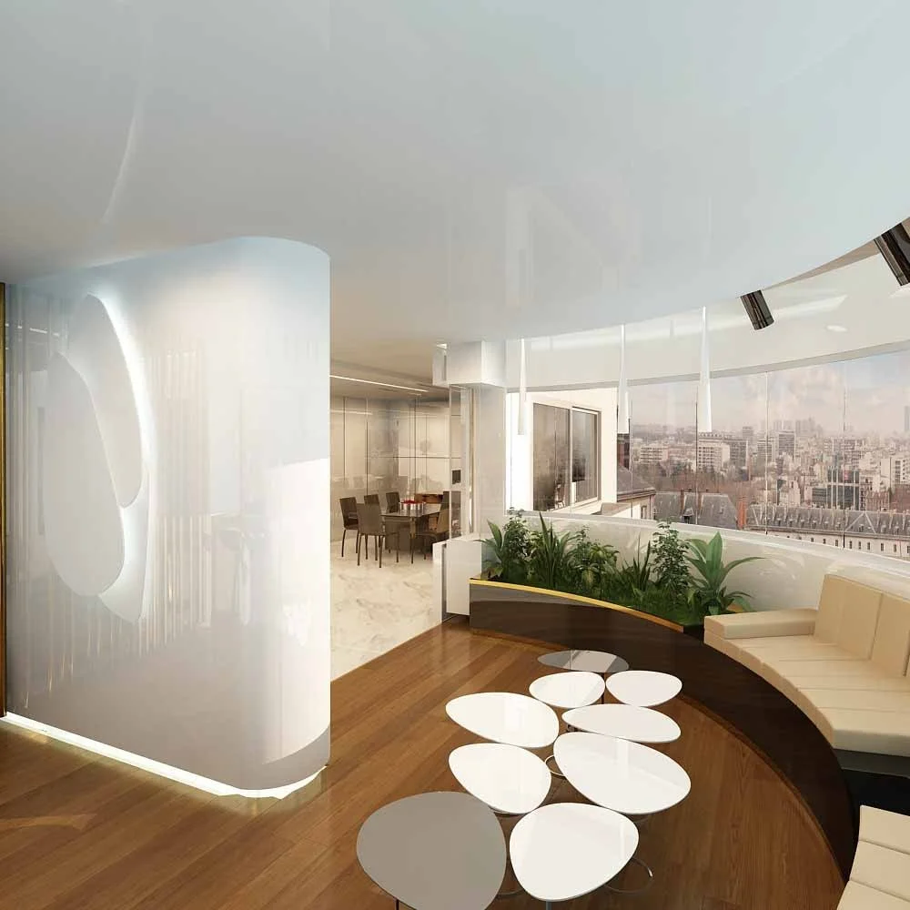 Modern office lounge with curved window wall, white seating, round white tables, green plants, and city view outside.