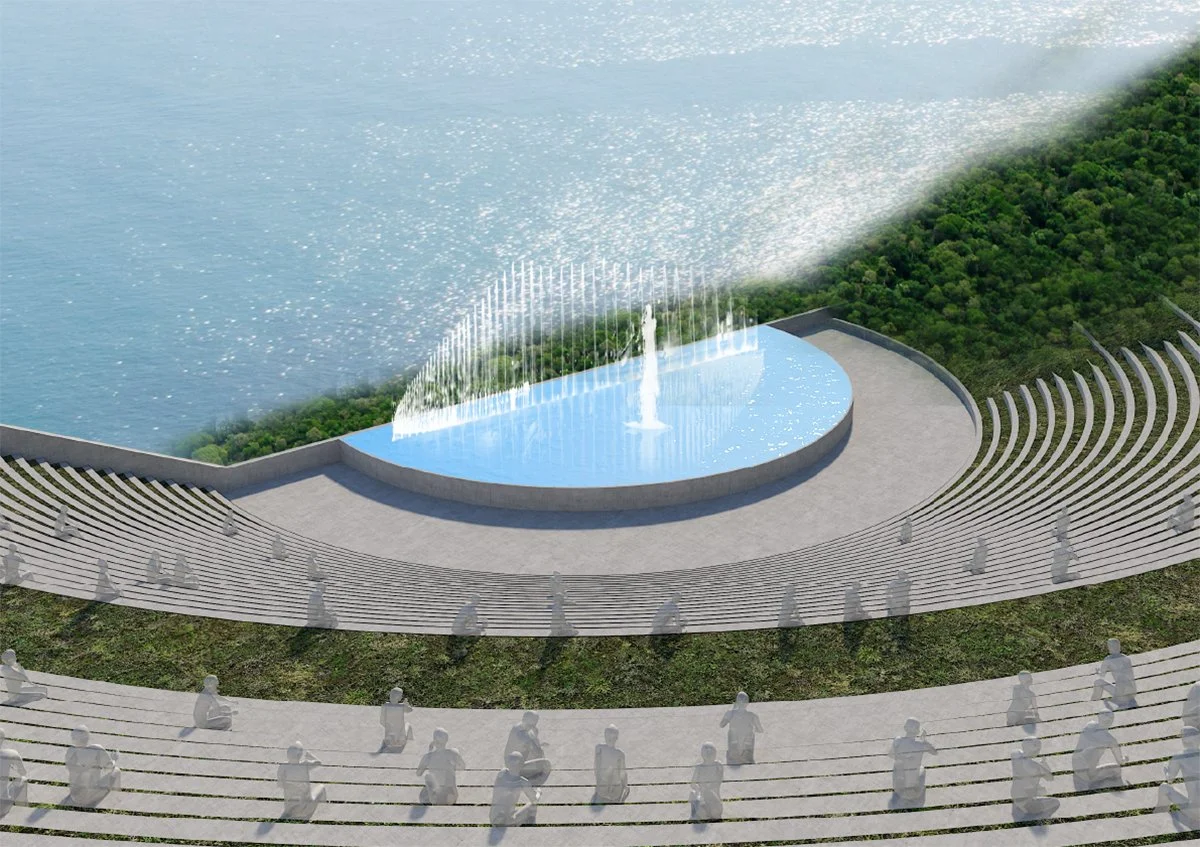 An outdoor amphitheater with curved seating, overlooking a body of water. In the center, there is a fountain surrounded by a semi-circular pool with water jets.
