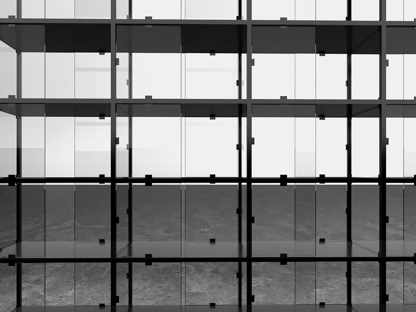 A modern, multi-story building with a glass facade and visible structural framework.