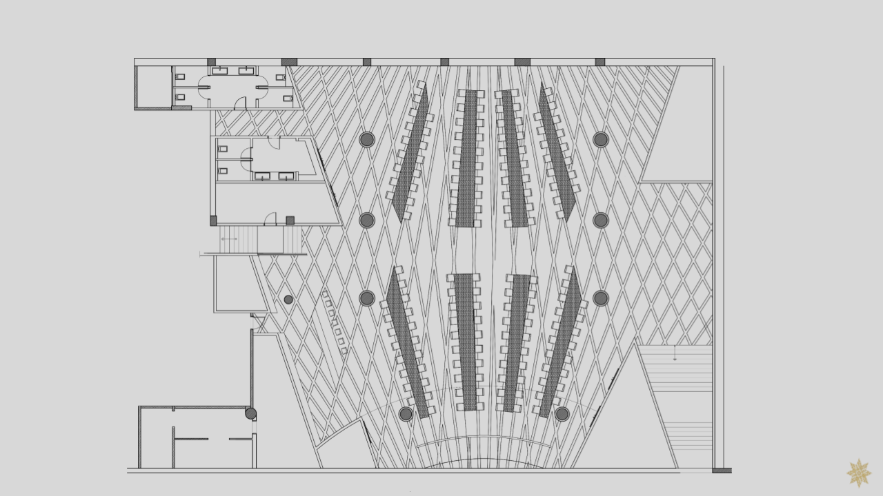 Floor plan of an auditorium or conference hall with rows of seats, stage area, and several smaller rooms.