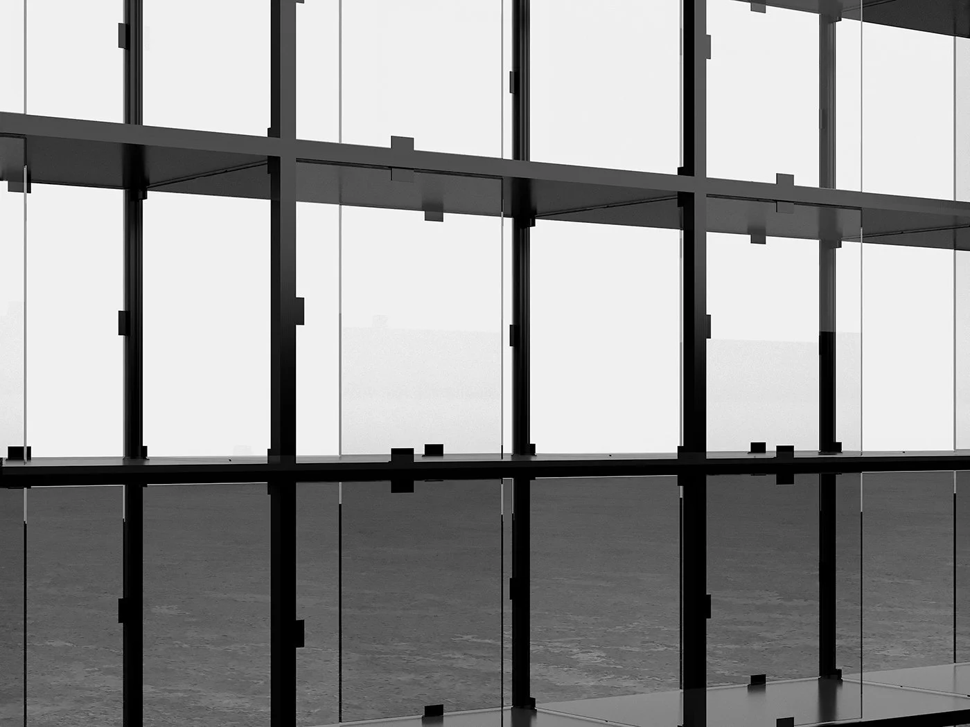 Interior view of a modern building with glass walls and metal framing, showing a symmetrical grid of large empty window sections against a cloudy sky.