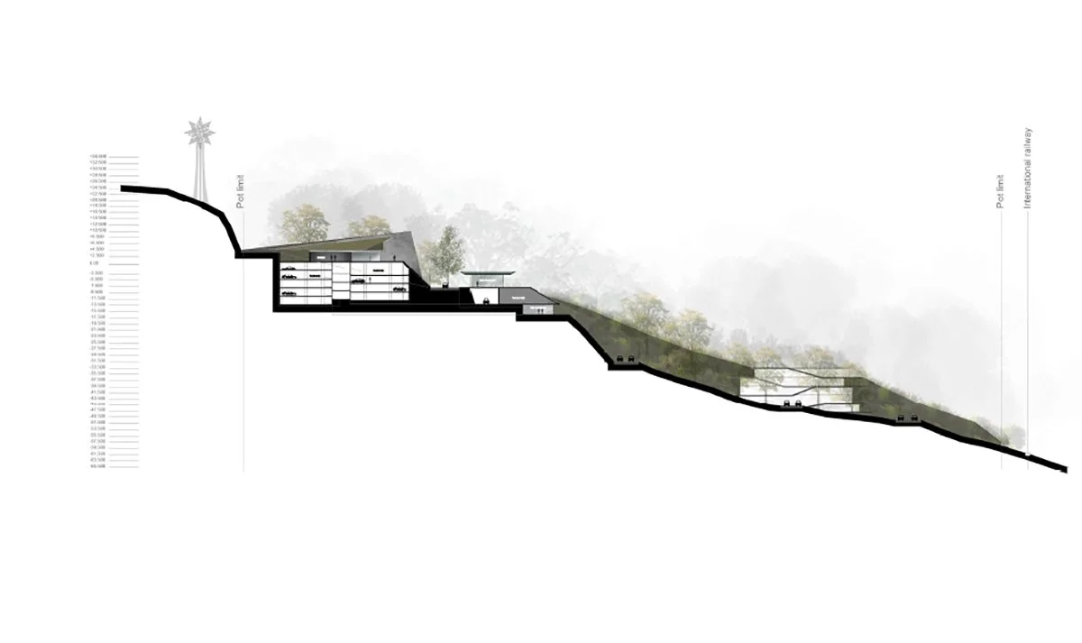 Architectural section drawing of a building on a hillside, showing multiple floors and underground levels, with trees and a star decoration at the top of the slope.