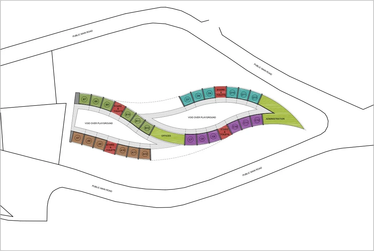 Site plan showing layout of a public park or playground with designated areas for different facilities, including toilets, offices, administration, and playground zones, surrounded by public main roads.