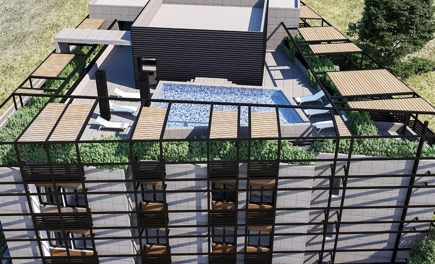 A rooftop of a modern apartment building with a pool, lounge chairs, and shaded pergolas. The rooftop is surrounded by greenery and enclosed with a black metal framework.