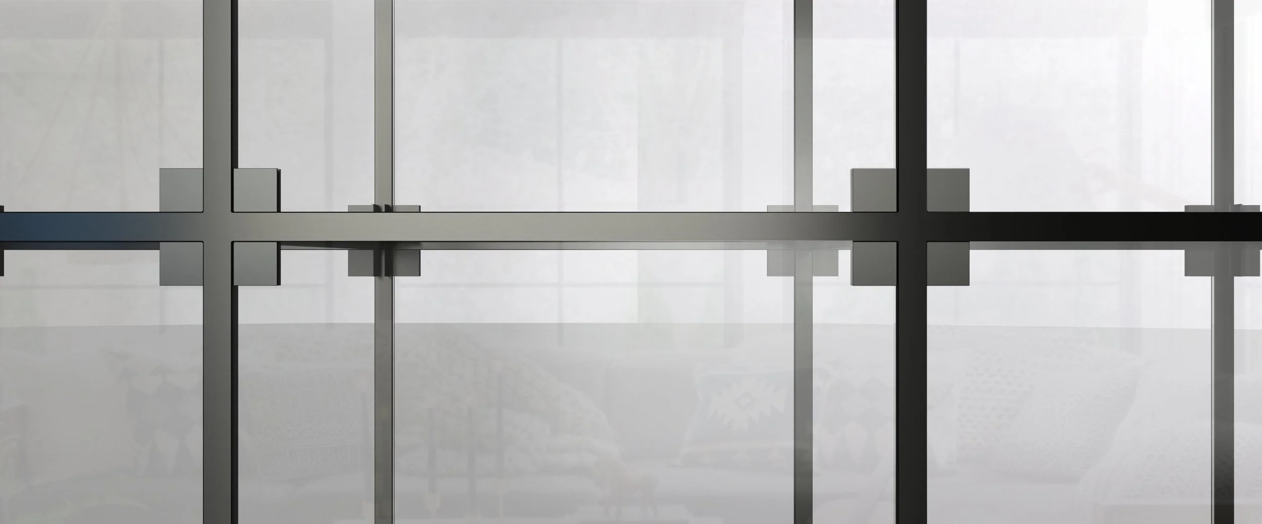 Close-up of a modern glass and metal window or door with intersecting metal frames, reflecting an indoor space with a bicycle and a patterned object.