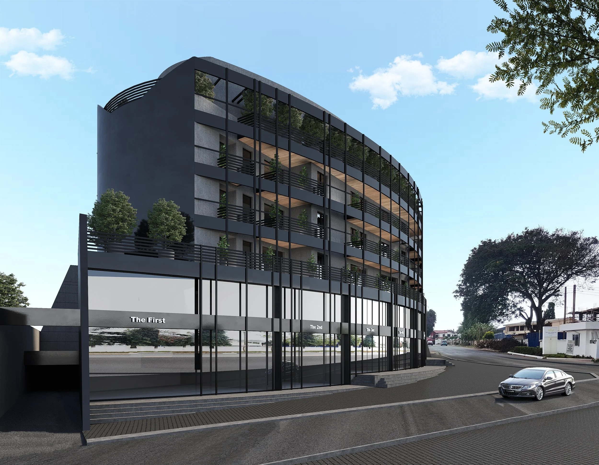 Modern multi-story building with glass facade, commercial spaces on the ground floor, and residential units with balconies and plants on the upper floors. A car is parked in front, and trees line the street under a blue sky.
