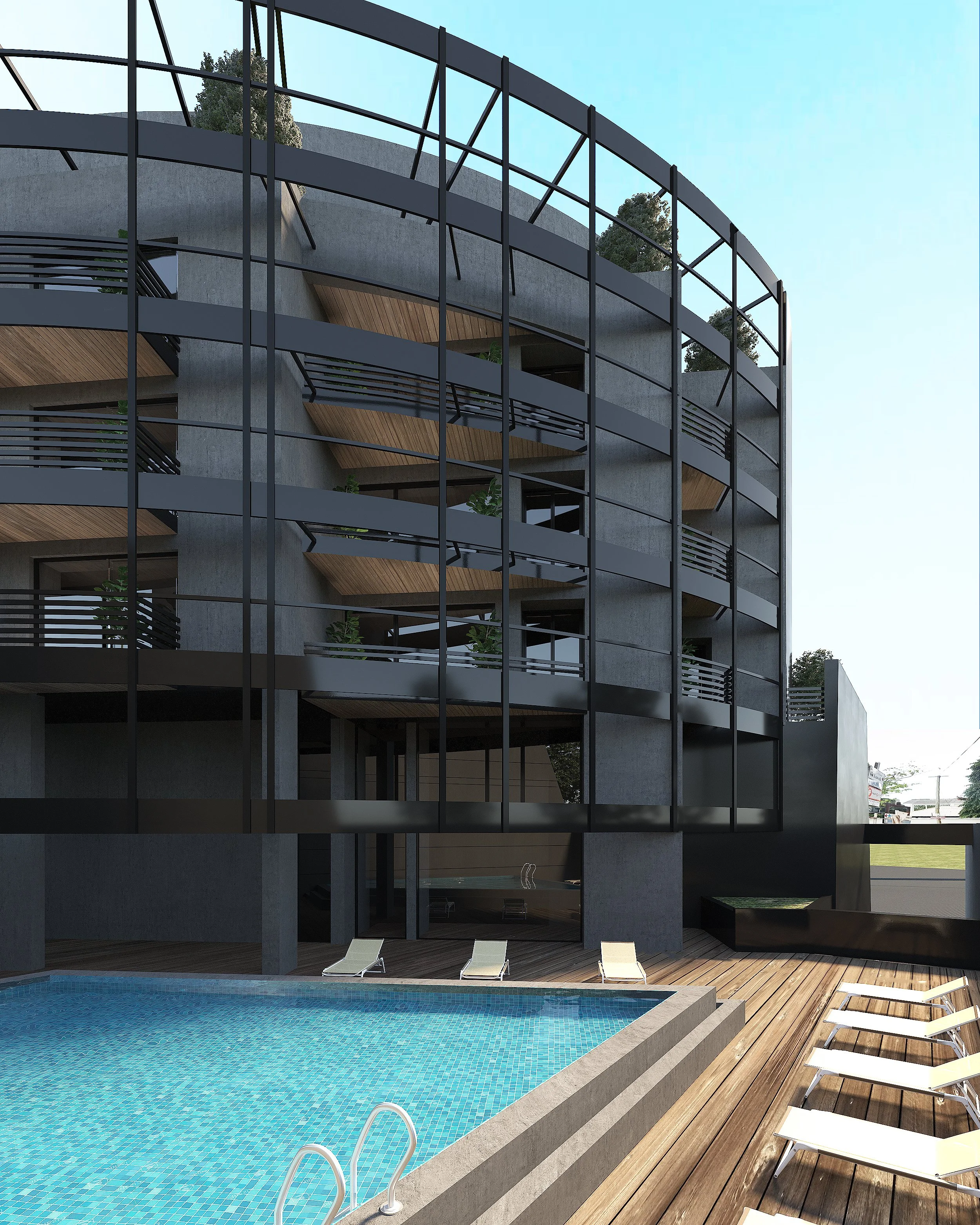 Modern multi-story building with curved balconies, large glass windows, and a rooftop garden, adjacent to an outdoor swimming pool with lounge chairs on a wooden deck.