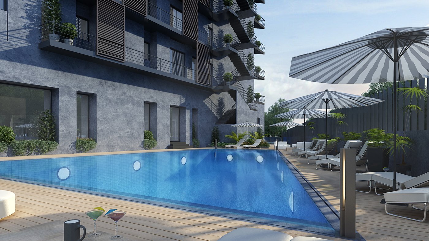 A luxurious outdoor swimming pool area at a modern apartment complex, with sun loungers, umbrellas, and surrounding greenery.