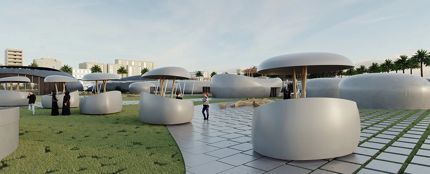 Modern outdoor public space with large, rounded white structures and potted mushroom-shaped umbrellas, some people walking and sitting, palm trees and buildings in the background, under a blue sky.
