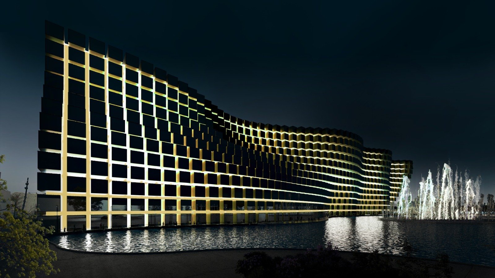 Nighttime view of a modern building with illuminated grid-like exterior and a water fountain in front.