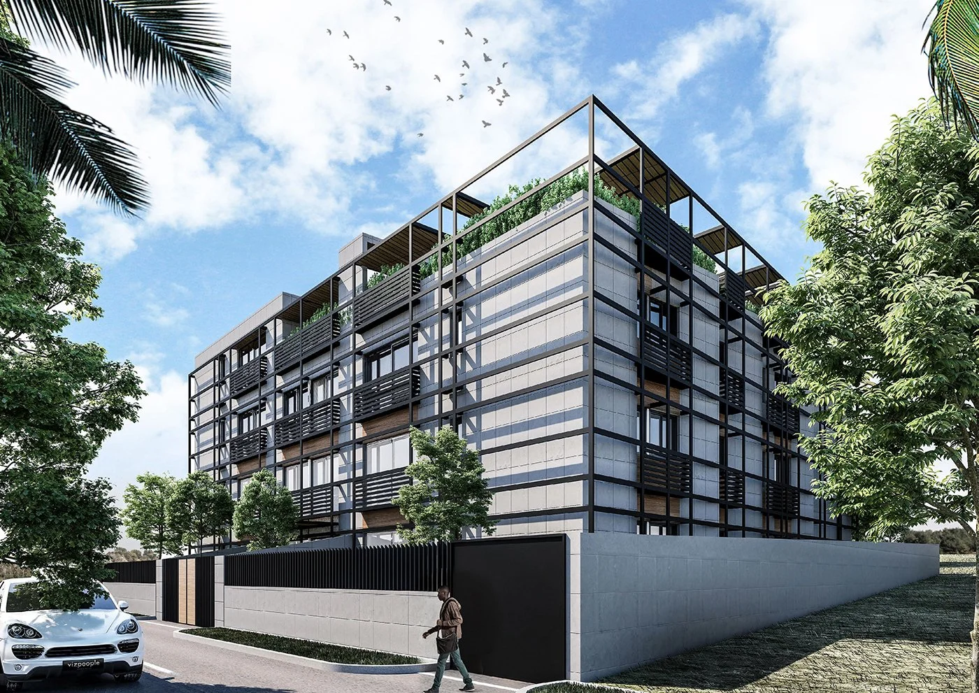Modern multi-story apartment building with large windows and a black metal framework, surrounded by trees and a concrete wall, with a person walking by and a white car parked on the street under a partly cloudy sky.