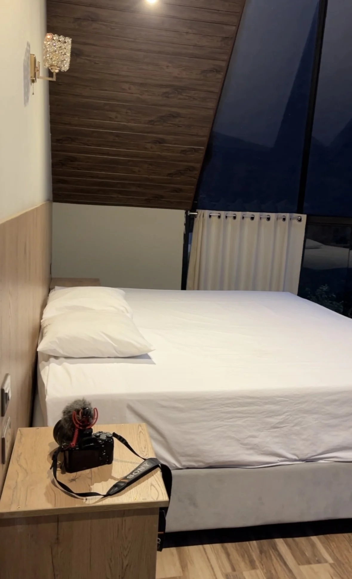 Peru, Salkantay Trek. A bedroom with a bed, white sheets, and a single pillow