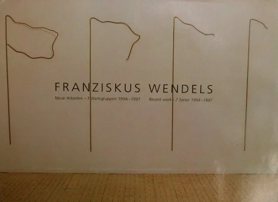 Ausstellungstafel mit dem Namen Franziskus Wendels und Text auf Deutsch.