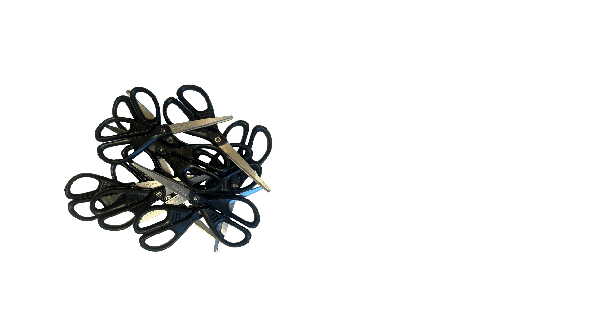 A pile of black scissors with metallic blades, some with scissors open, on a black background.