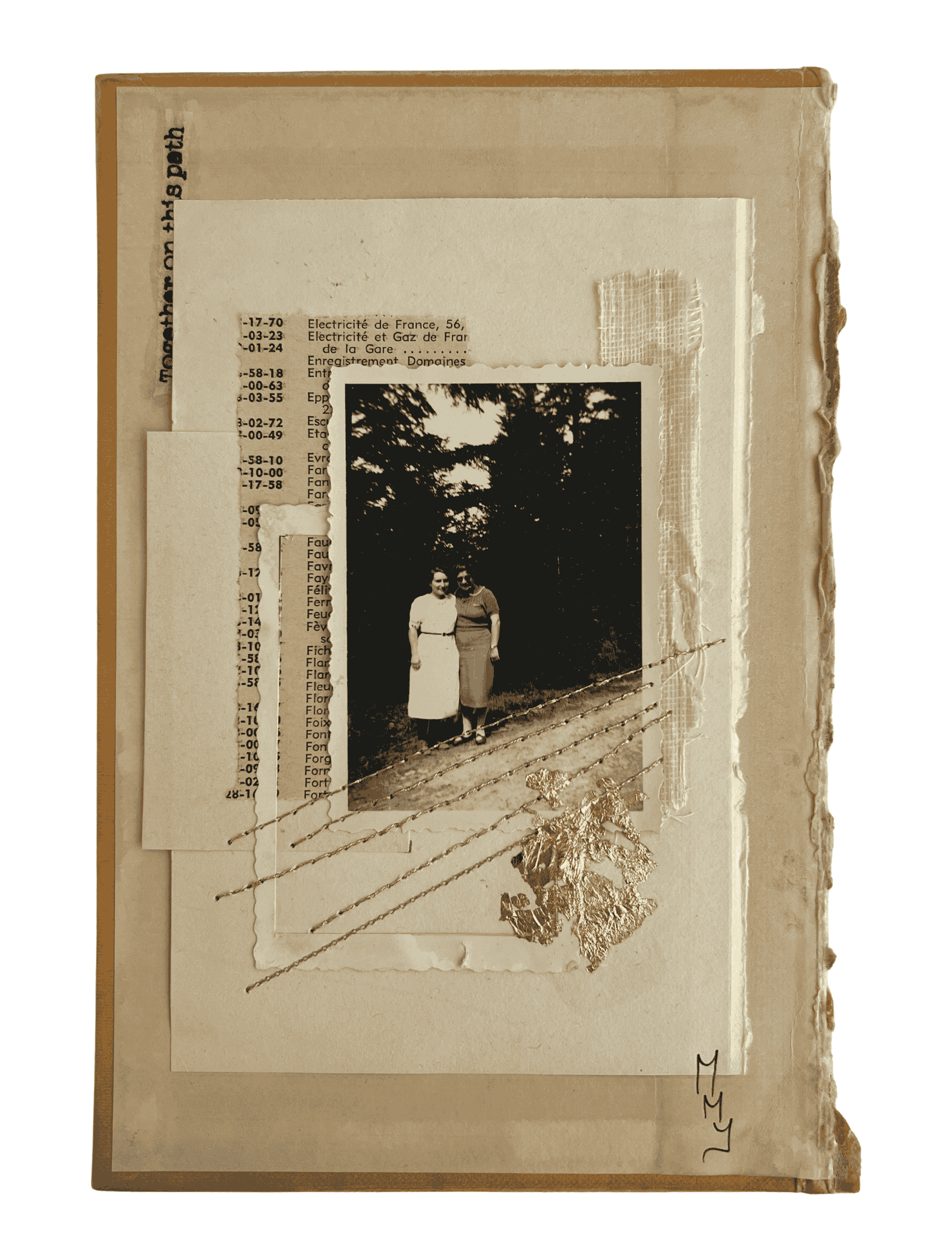 A vintage-colored scrapbook page featuring an old black-and-white photo of two women standing outdoors with trees in the background. The page includes torn paper, a string with a leaf and gold decorative embellishments, and handwritten initials "L M" in the bottom right corner.