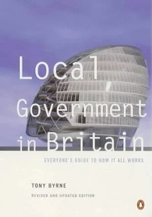 Book cover titled 'Local Government in Britain' by Tony Byrne, featuring a modern government building with a curved glass facade.
