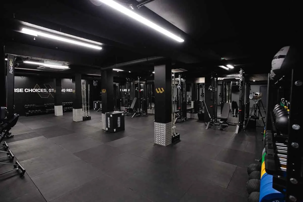 A fully stocked gym showcasing a range of exercise equipment available at WiseFitt Fulham