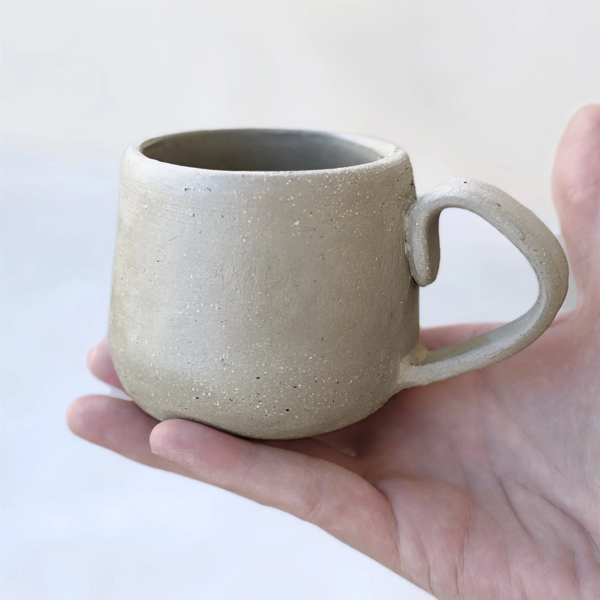 Finished handbuilt round mug with measurements, created using printable pottery template, perfect for beginner ceramics, free pottery tool for download for modern kitchen decor.