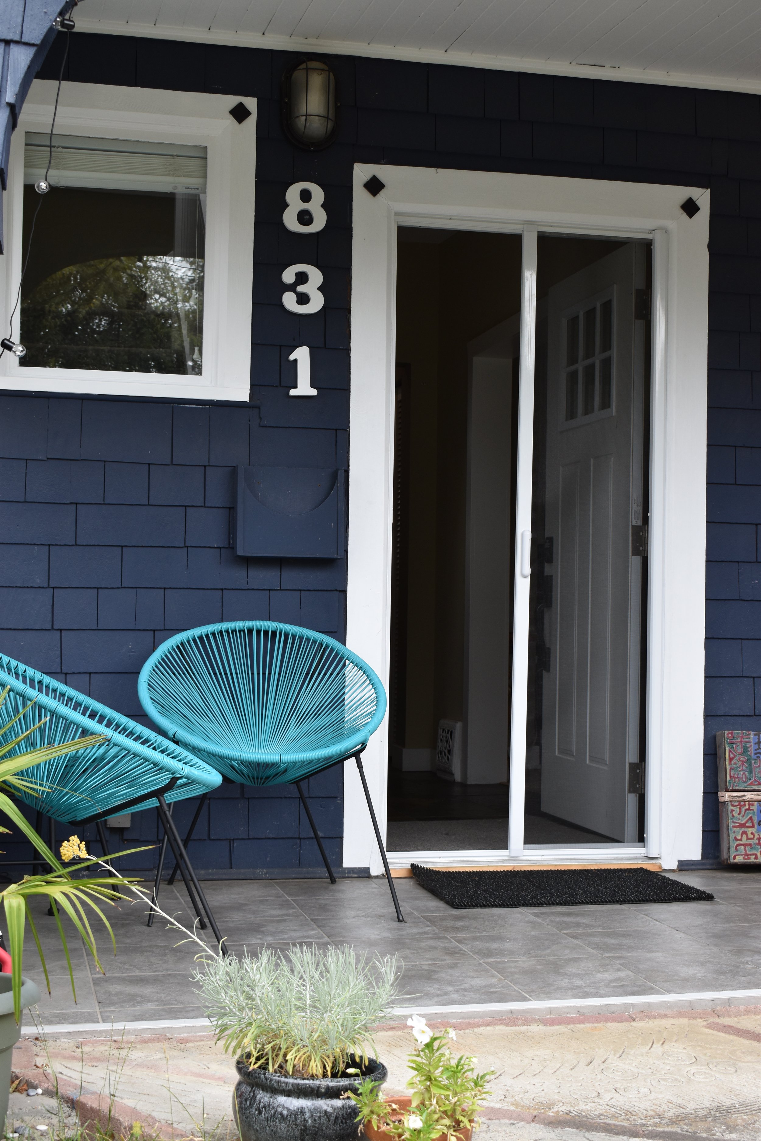 Motorized retractable door screen on a patio entry providing privacy and insect protection