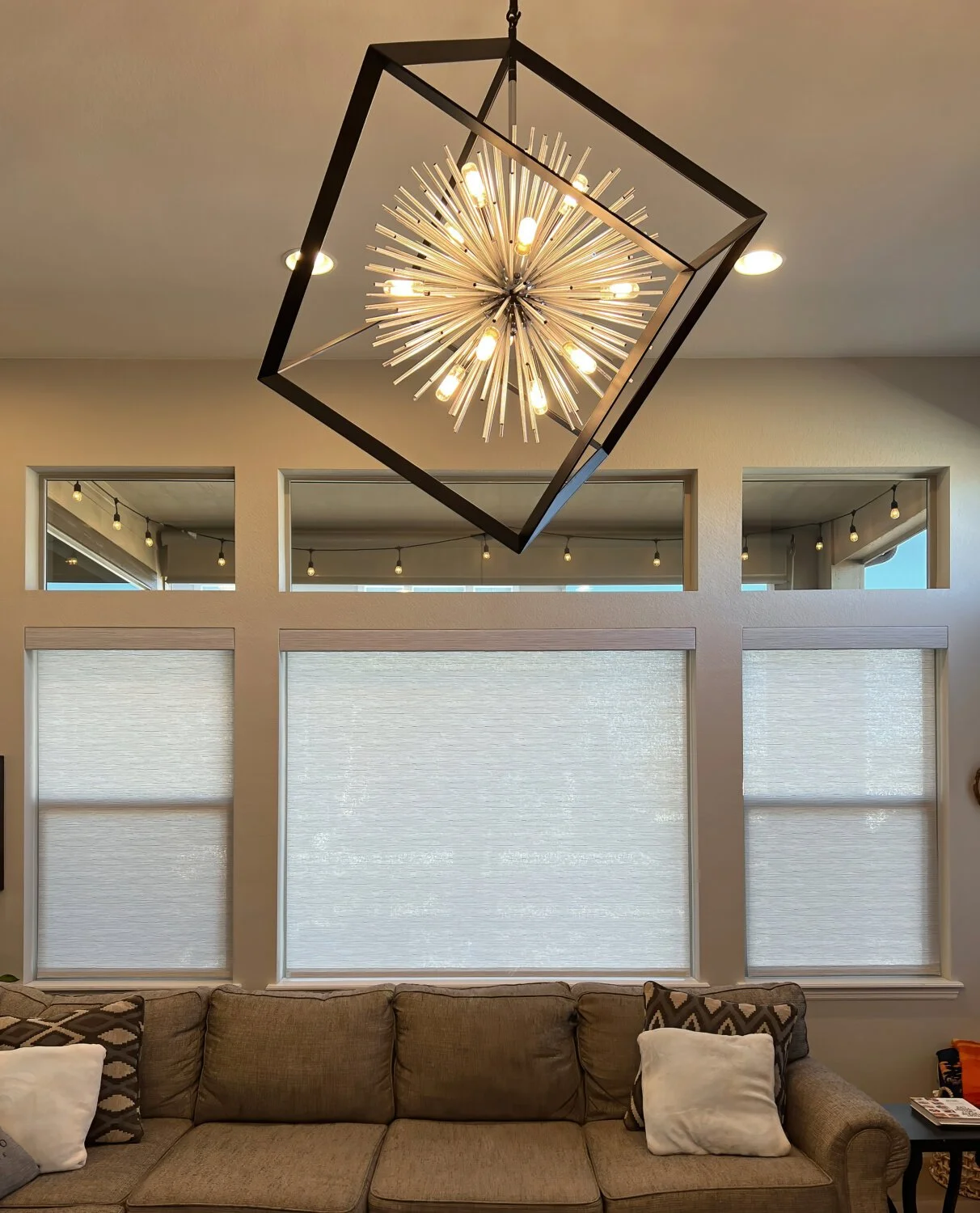 Cheetah Screens professional installing a motorized retractable awning on a residential patio