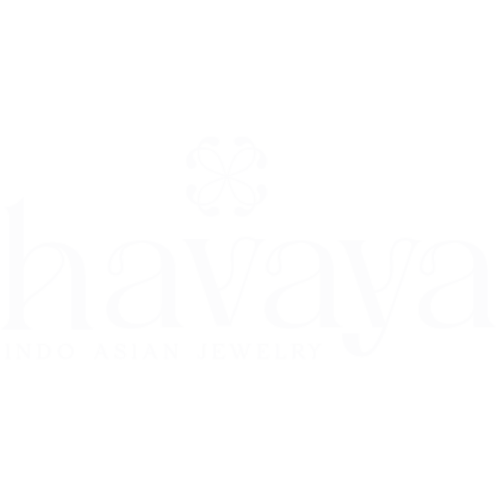 A large white truck with a yellow stripe on its cargo area, parked on a street, with a black sky in the background.