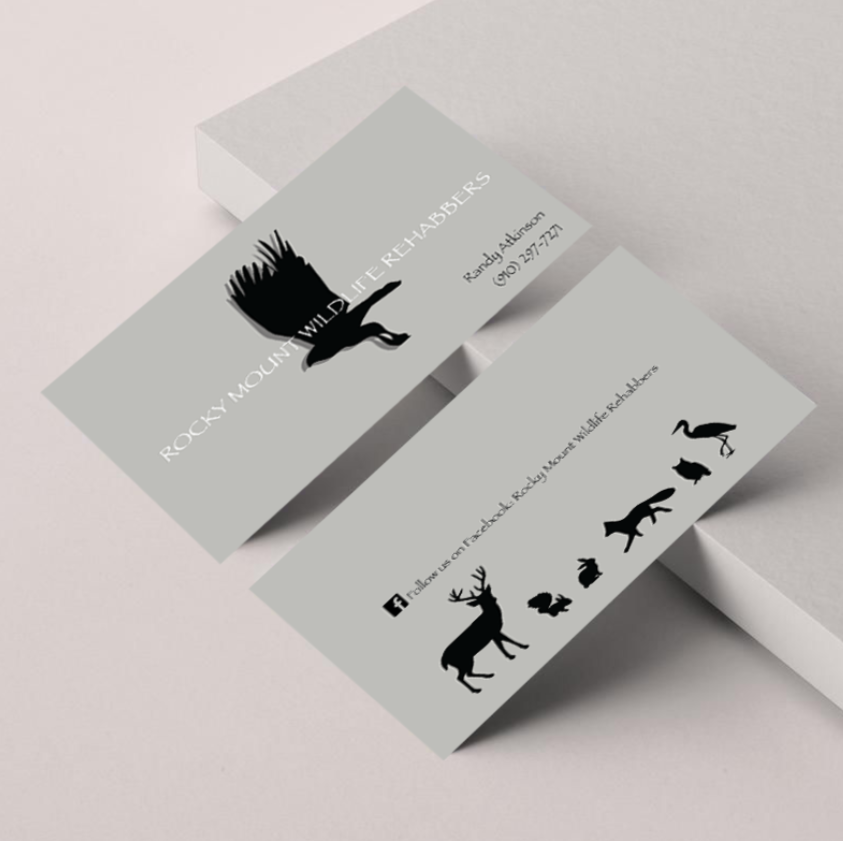 Business cards for Rocky Mountain Wildlife Rehabilitators featuring black silhouettes of wild animals, including a hawk, deer, raccoon, fox, and bear.