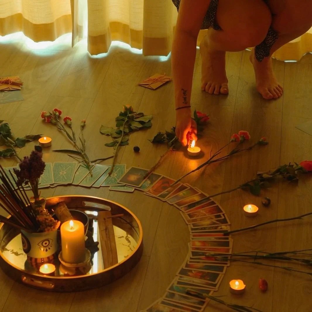 Full moon reiki circle altar with candles, crystals and tarot cards